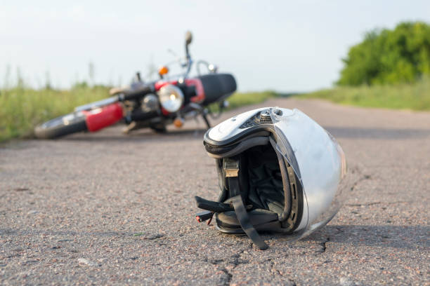 Photo of helmet and motorcycle on road